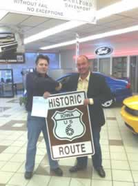 Dave Darby w/ Route 6 sign @ Dahl Ford, Davenport IA