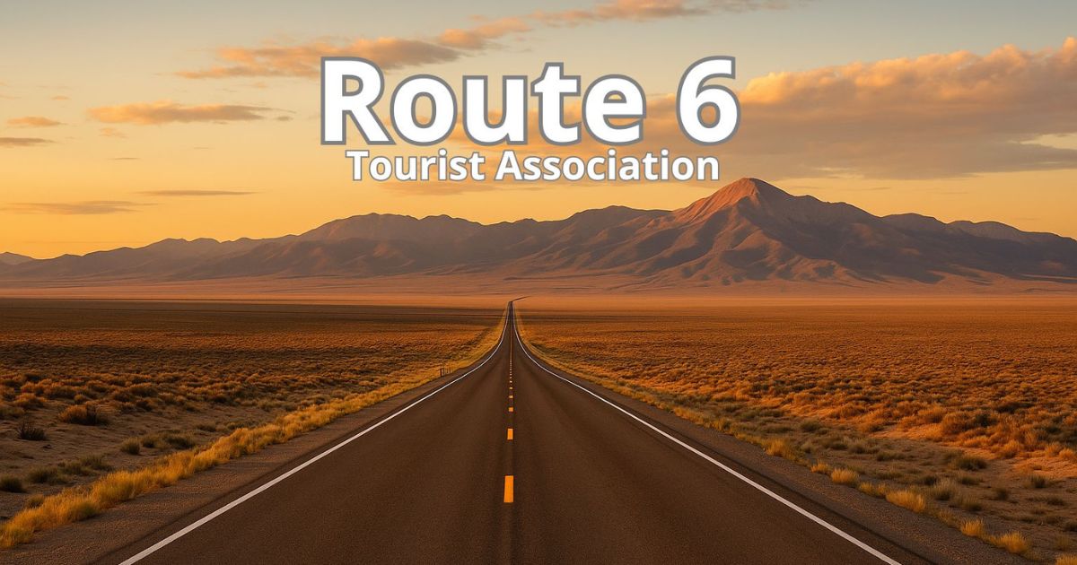 "View of US Route 6 stretching across the Nevada desert near Wheeler Peak at sunset"