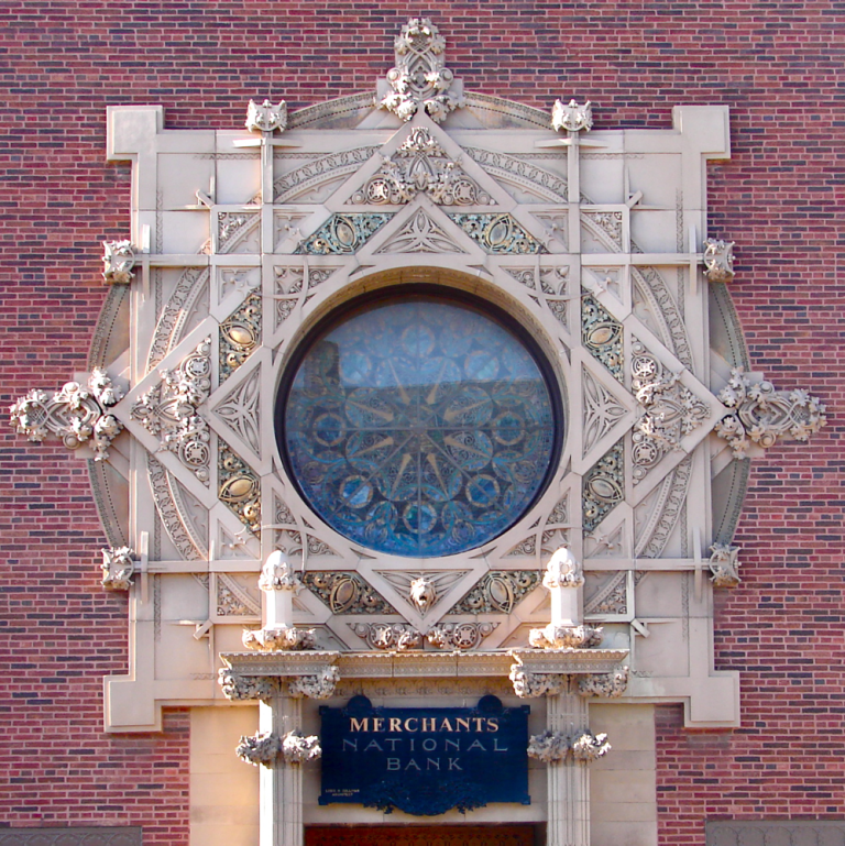 The ornate stained-glass rose window and terra cotta details of Louis Sullivan’s Merchants’ National Bank (1914) in downtown Grinnell
