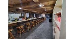 THE WORLD'S LONGEST BAR MADE FROM ONE CONTINUOUS PIECE OF WOOD