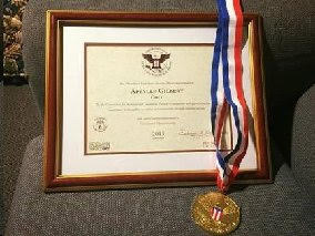 Aprylle Gilbert's Presidential Volunteer Service Award and Gold medal